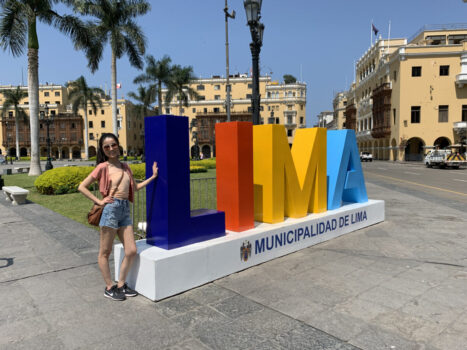 In front of the Lima sign